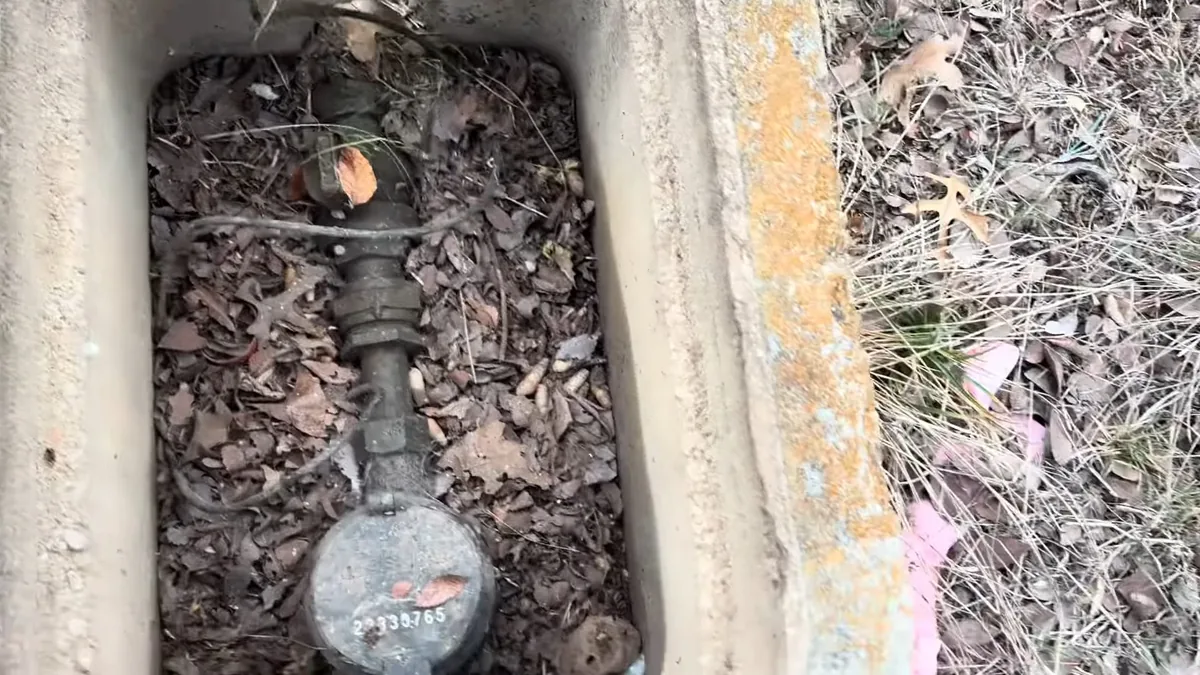 Open water meter box used to check for hidden leaks for 7 Early Warning Signs You Need a Plumber in Fountain Valley